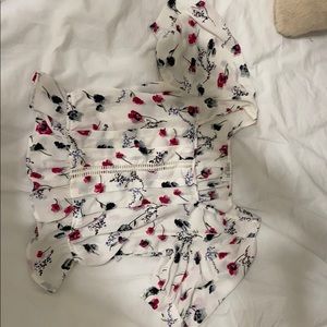 White shirt with floral printings on it